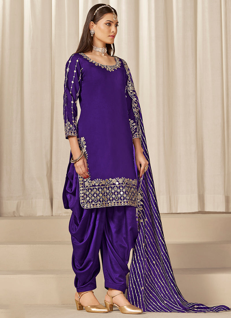 Roman Silk Purple Wedding Wear Zari Embroidery Work Patiala Suit 381205
