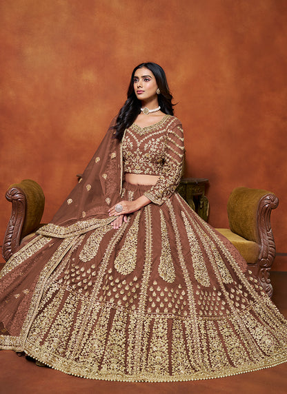 386710 Net Brown Wedding Wear Zari Embroidery Work Lehenga Choli