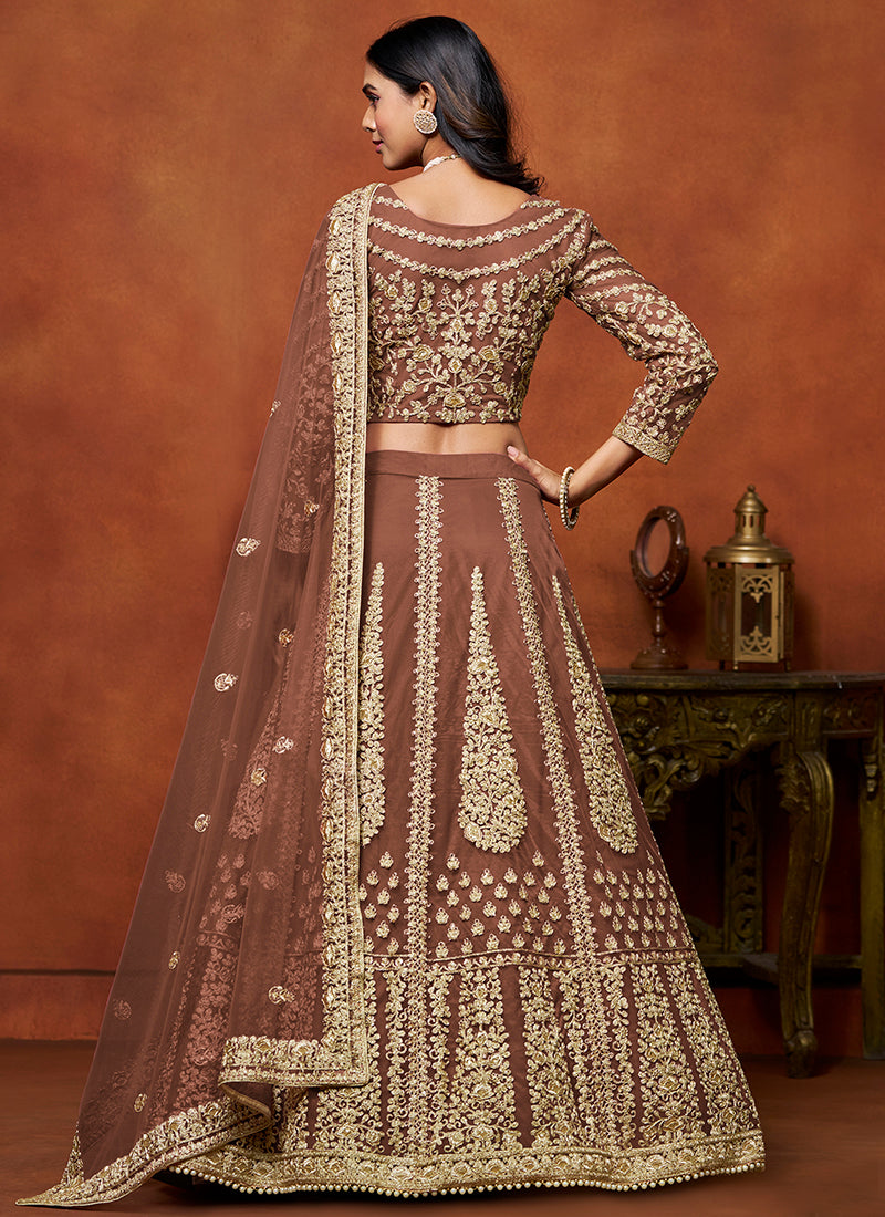 386710 Net Brown Wedding Wear Zari Embroidery Work Lehenga Choli