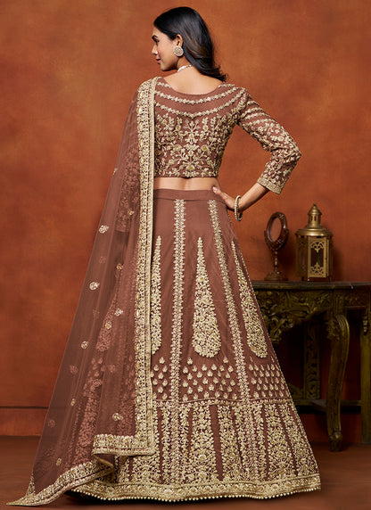 386710 Net Brown Wedding Wear Zari Embroidery Work Lehenga Choli