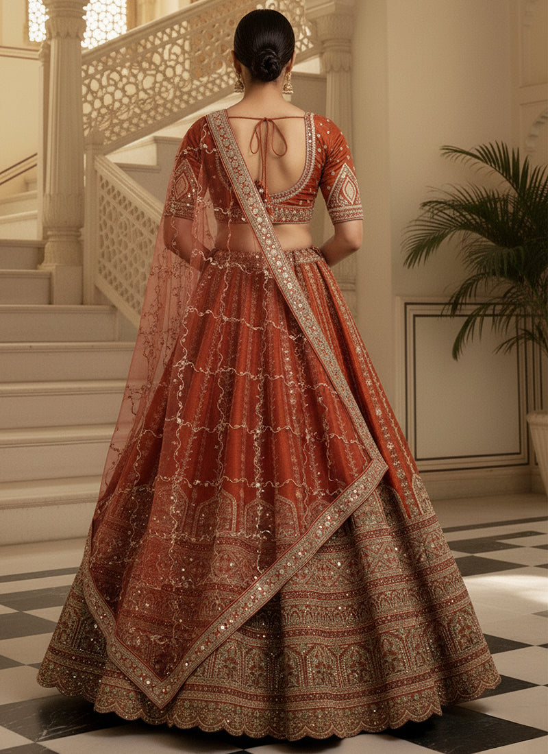Gadhwal Silk Orange Bridal Wear Heavy Work Lehenga Choli 387445