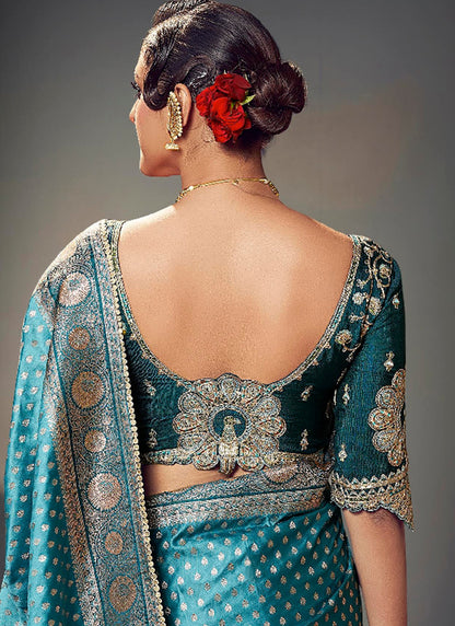 Fancy Fabric Teal Blue Wedding Wear Embroidery Work Saree 385872